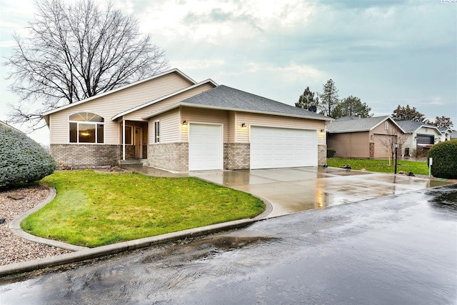 view of front facade with a garage and a front lawn