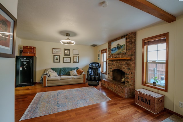 2929 S Ledbetter Pl, Kennewick, WA 99337 - living area featuring wood finished floors, a fireplace, and beam ceiling