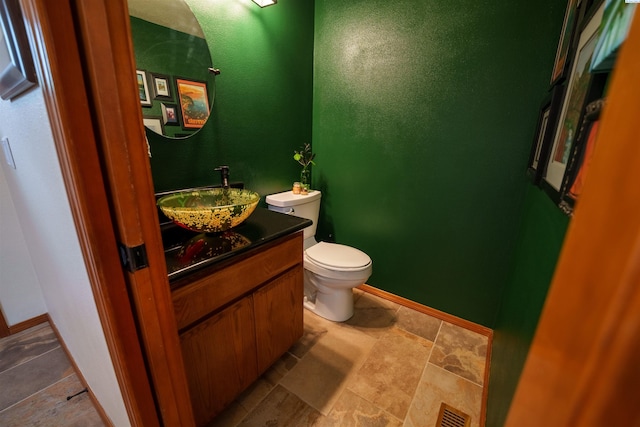 2929 S Ledbetter Pl, Kennewick, WA 99337 - half bathroom featuring vanity and stone finish flooring