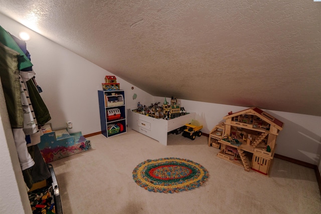 2929 S Ledbetter Pl, Kennewick, WA 99337 - rec room featuring a textured ceiling, vaulted ceiling, and carpet