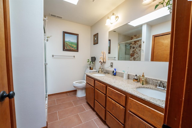 2929 S Ledbetter Pl, Kennewick, WA 99337 - full bath featuring a stall shower, double vanity, and tile patterned floors