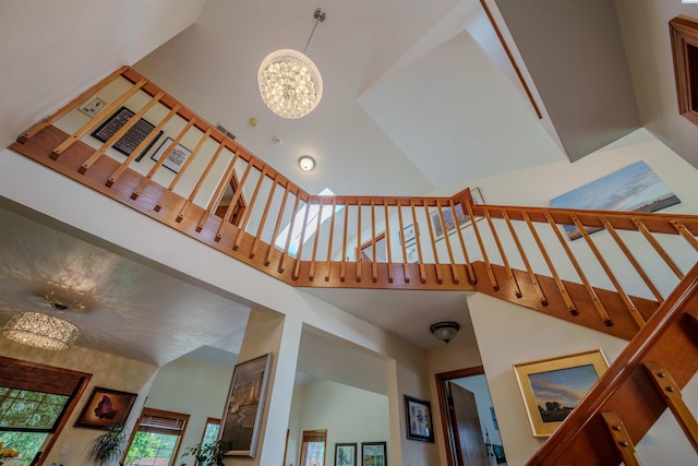 2929 S Ledbetter Pl, Kennewick, WA 99337 - stairs with high vaulted ceiling and a chandelier