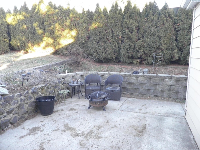 view of patio / terrace featuring a fire pit