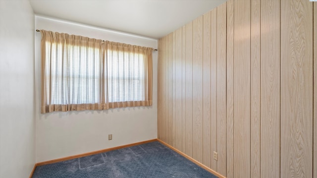 2111 W 20th Ave, Kennewick, WA 99337 - empty room with dark colored carpet and wooden walls