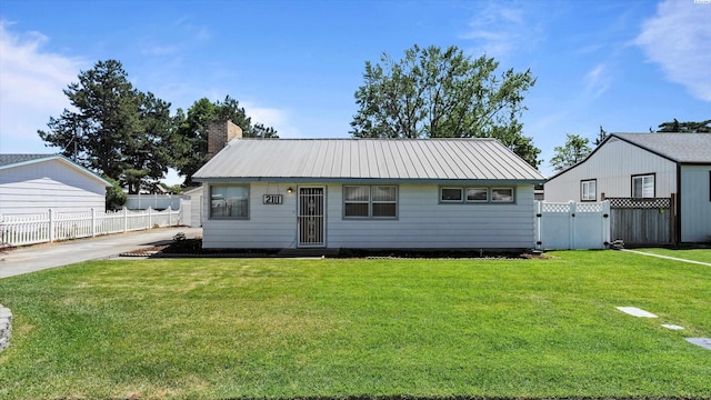 2111 W 20th Ave, Kennewick, WA 99337 - view of front of home featuring a gate, a chimney, and a metal roof