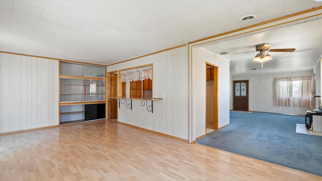 2111 W 20th Ave, Kennewick, WA 99337 - empty room featuring wood finished floors, ceiling fan, and wood walls