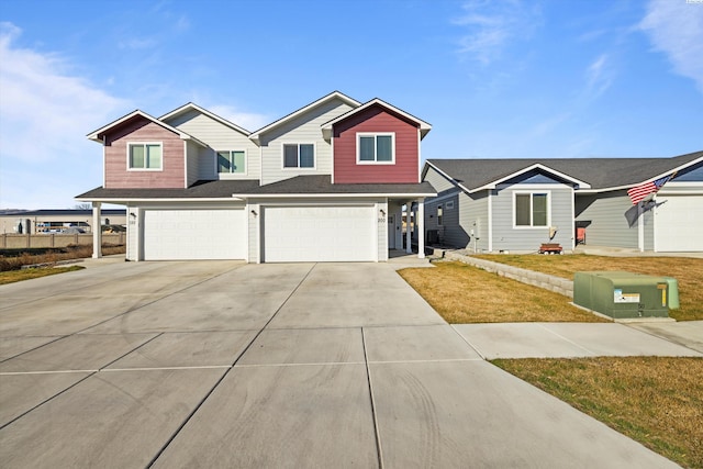 view of front facade featuring concrete driveway and a garage