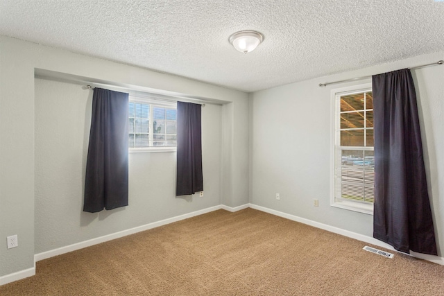1621 S Fruitland St, Kennewick, WA 99337 - carpeted spare room featuring a textured ceiling and baseboards