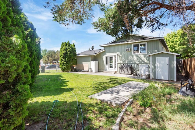 1621 S Fruitland St, Kennewick, WA 99337 - rear view of house featuring a storage unit, a patio, and entry steps
