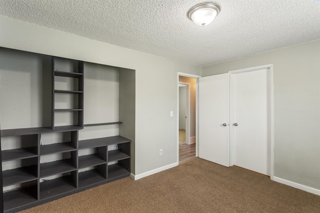 1621 S Fruitland St, Kennewick, WA 99337 - unfurnished bedroom with carpet floors, a textured ceiling, and a closet