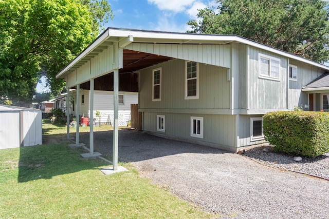1621 S Fruitland St, Kennewick, WA 99337 - view of home's exterior featuring a shed, driveway, a yard, and an attached carport