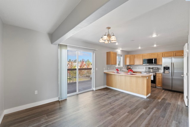 kitchen featuring appliances with stainless steel finishes, decorative light fixtures, dark hardwood / wood-style flooring, light brown cabinets, and kitchen peninsula