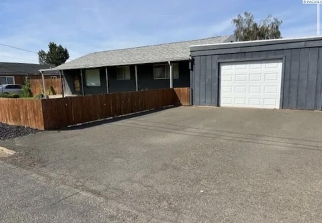 single story home featuring a garage