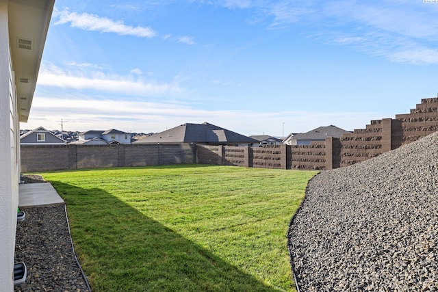 view of yard featuring visible vents and fence