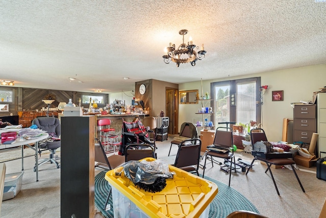 5820 W Park Pl, Pasco, WA 99301 - carpeted dining space with a textured ceiling and a chandelier