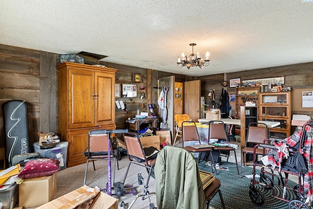 5820 W Park Pl, Pasco, WA 99301 - carpeted dining room with a textured ceiling, a chandelier, and wooden walls