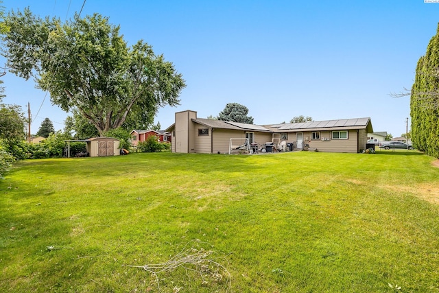 5820 W Park Pl, Pasco, WA 99301 - view of grassy yard with a shed