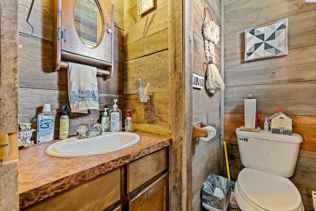 5820 W Park Pl, Pasco, WA 99301 - bathroom featuring vanity and wood walls