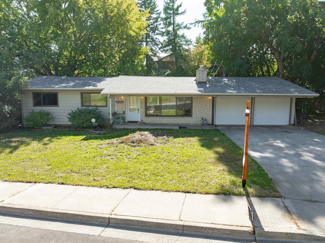 625 SW Dawnview Ct, Pullman, WA 99163 - ranch-style home featuring an attached garage, a front lawn, driveway, a chimney, and brick siding