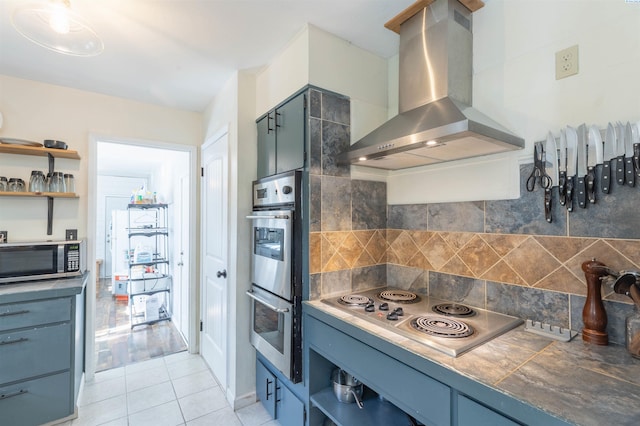 625 SW Dawnview Ct, Pullman, WA 99163 - kitchen featuring wall chimney exhaust hood, stainless steel appliances, open shelves, and decorative backsplash