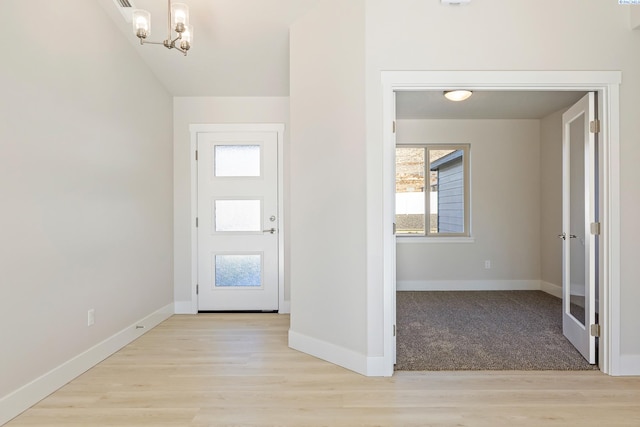 6435 W 30th Pl, Kennewick, WA 99338 - foyer entrance featuring healthy amount of natural light, a chandelier, and light wood-type flooring