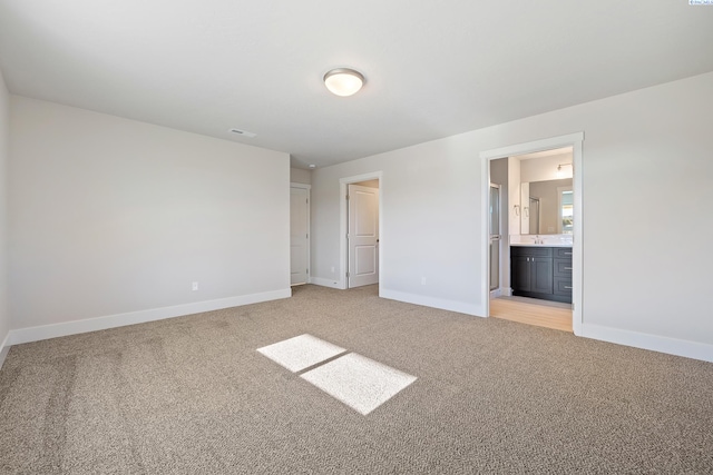 6435 W 30th Pl, Kennewick, WA 99338 - unfurnished bedroom with light colored carpet and ensuite bathroom