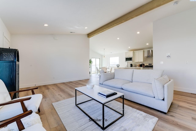 living room featuring light wood-style flooring, recessed lighting, and baseboards