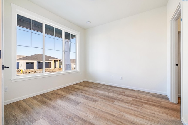 empty room with light hardwood / wood-style floors