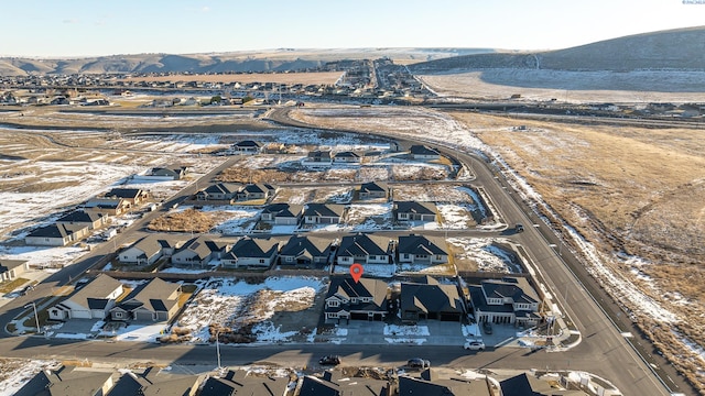 birds eye view of property with a mountain view