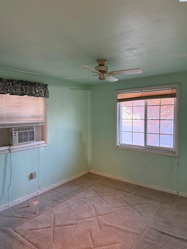 empty room featuring cooling unit and ceiling fan