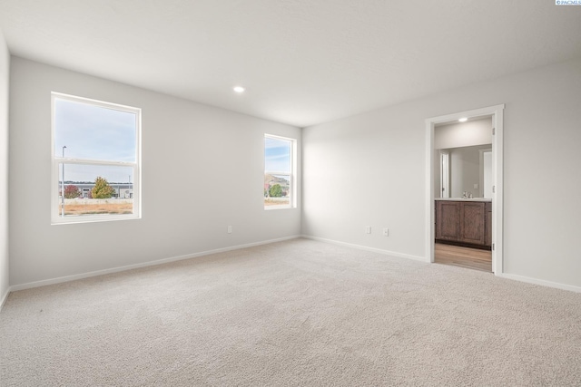 704 S Zeelar St, Kennewick, WA 99336 - unfurnished bedroom with light carpet, baseboards, recessed lighting, and ensuite bath