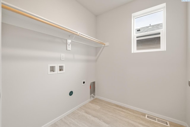 704 S Zeelar St, Kennewick, WA 99336 - laundry room featuring hookup for an electric dryer, light wood finished floors, hookup for a washing machine, and baseboards