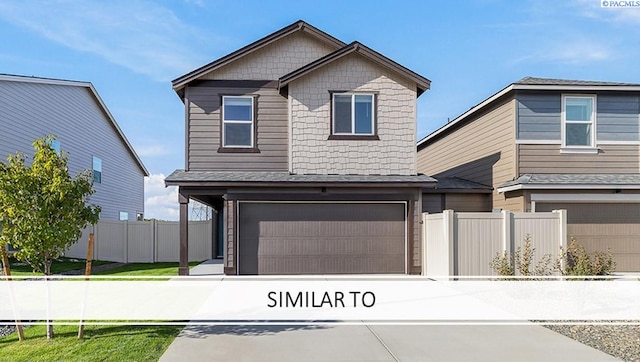 704 S Zeelar St, Kennewick, WA 99336 - view of front of home with a garage and concrete driveway
