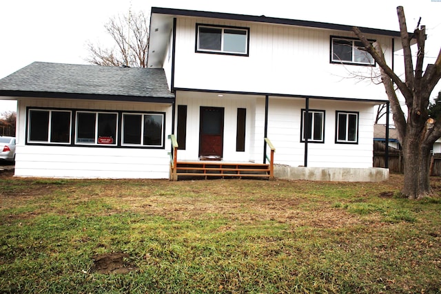 back of house featuring a yard