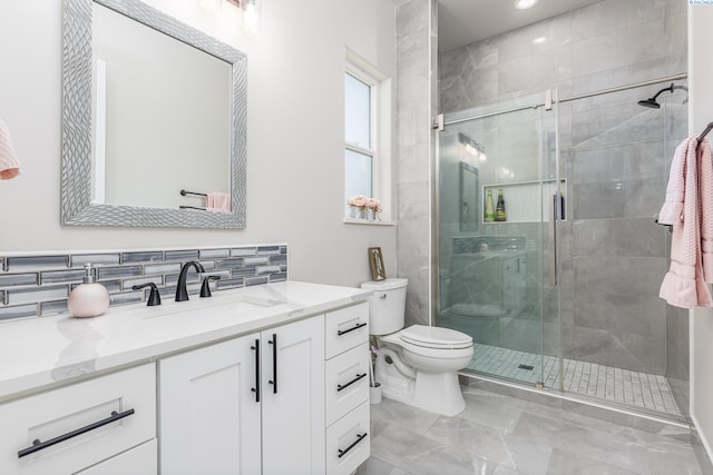 full bathroom with vanity, toilet, marble finish floor, recessed lighting, and a shower stall