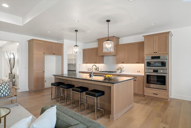 670 Cortona Unit 39, Richland, WA 99352 - kitchen with stainless steel double oven, a sink, tasteful backsplash, recessed lighting, and dark countertops