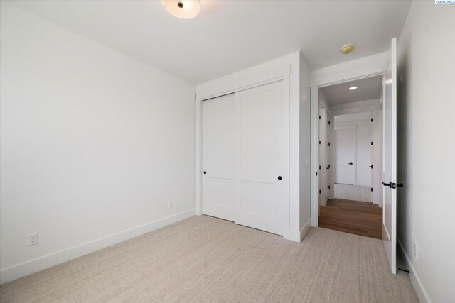670 Cortona Unit 39, Richland, WA 99352 - unfurnished bedroom featuring carpet, a closet, and baseboards