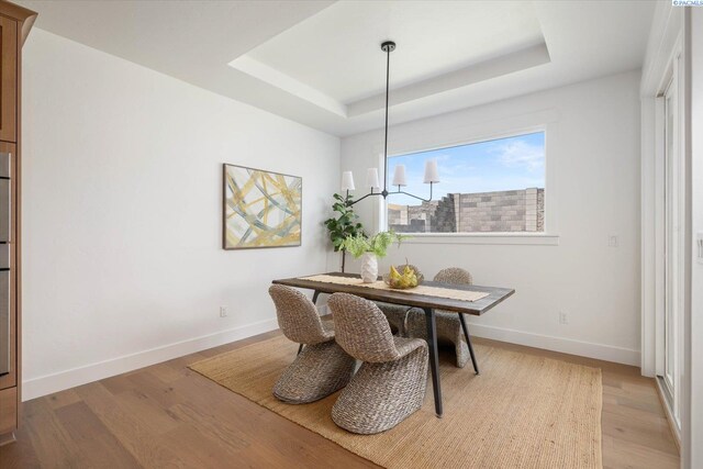 670 Cortona Unit 39, Richland, WA 99352 - dining room with a raised ceiling, wood finished floors, and baseboards