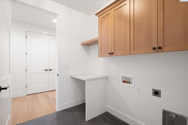 670 Cortona Unit 39, Richland, WA 99352 - washroom featuring hookup for an electric dryer, cabinet space, baseboards, washer hookup, and hookup for a gas dryer