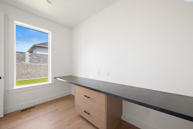 670 Cortona Unit 39, Richland, WA 99352 - unfurnished office with built in study area, plenty of natural light, light wood finished floors, and baseboards