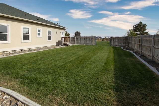 view of yard featuring central AC unit