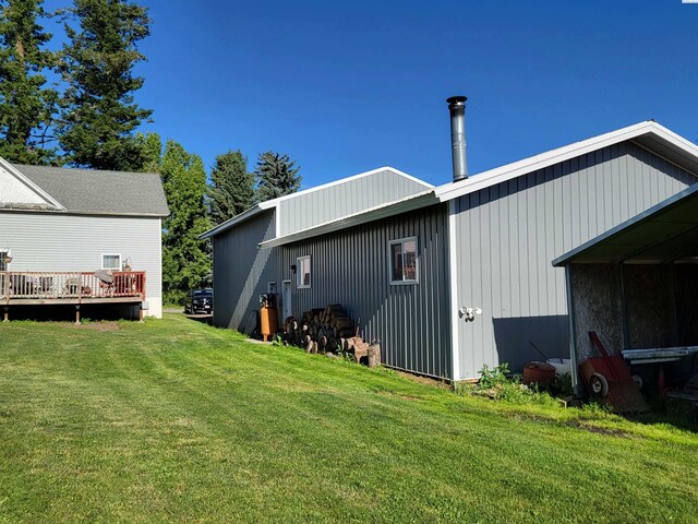 132 2nd St, Diamond, WA 99111 - rear view of house featuring a lawn