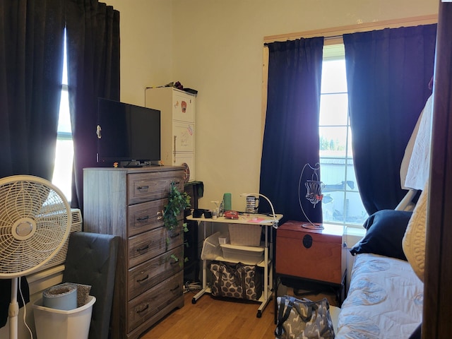 132 2nd St, Diamond, WA 99111 - bedroom featuring multiple windows and wood finished floors
