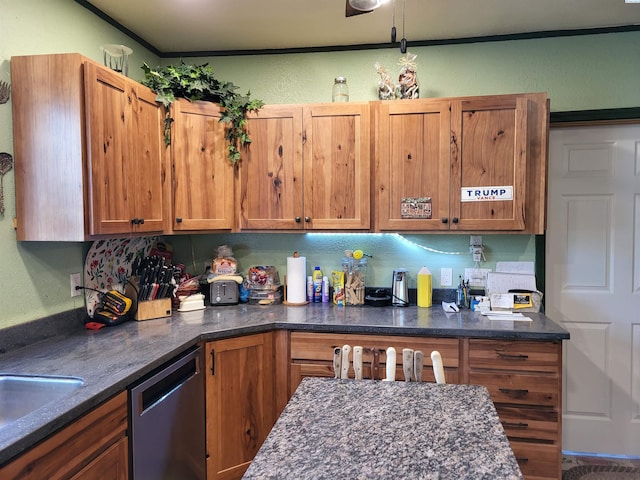 132 2nd St, Diamond, WA 99111 - kitchen with stainless steel dishwasher, brown cabinets, dark stone counters, and ornamental molding