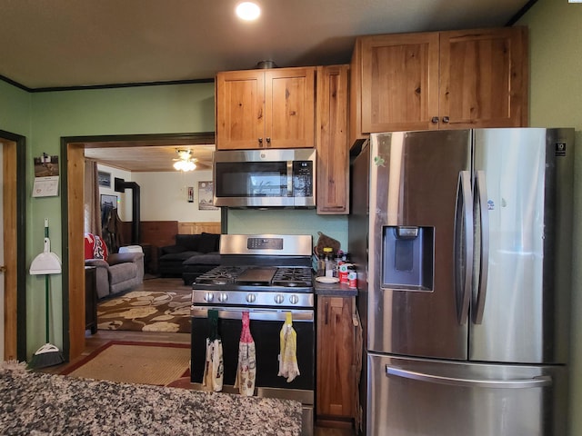 132 2nd St, Diamond, WA 99111 - kitchen with appliances with stainless steel finishes, dark countertops, and wood finished floors