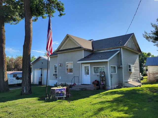 132 2nd St, Diamond, WA 99111 - back of house with a yard, an outbuilding, and a shingled roof