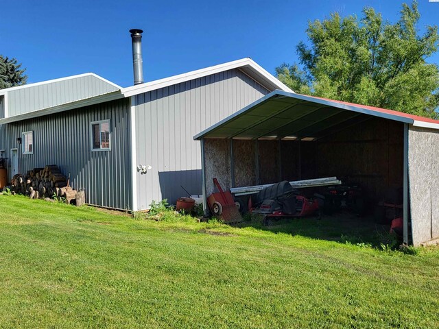 132 2nd St, Diamond, WA 99111 - view of pole building featuring a lawn and a detached carport