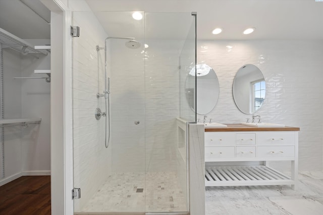 bathroom with vanity and an enclosed shower