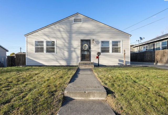 view of front of property with fence and a front yard