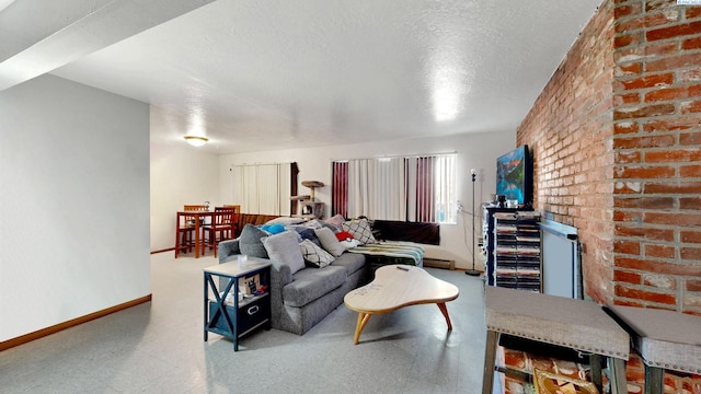 1735 NE Wheatland Dr, Pullman, WA 99163 - living room with baseboards, brick wall, a textured ceiling, tile patterned floors, and baseboard heating